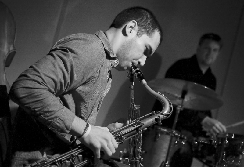 Joe Berry Playing Two Saxophones w/ Stage Lighting